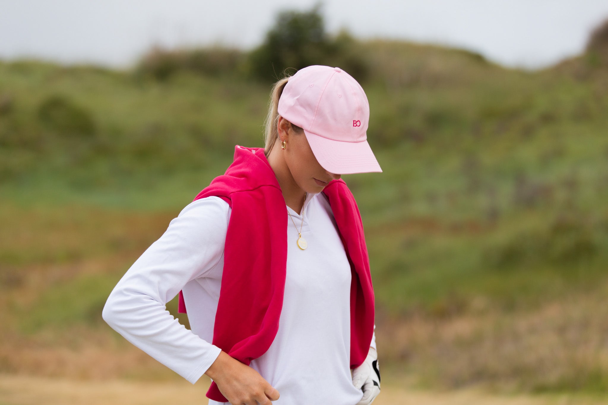 Birdie Club womens golf cap in pink with embroidered logo, front view.