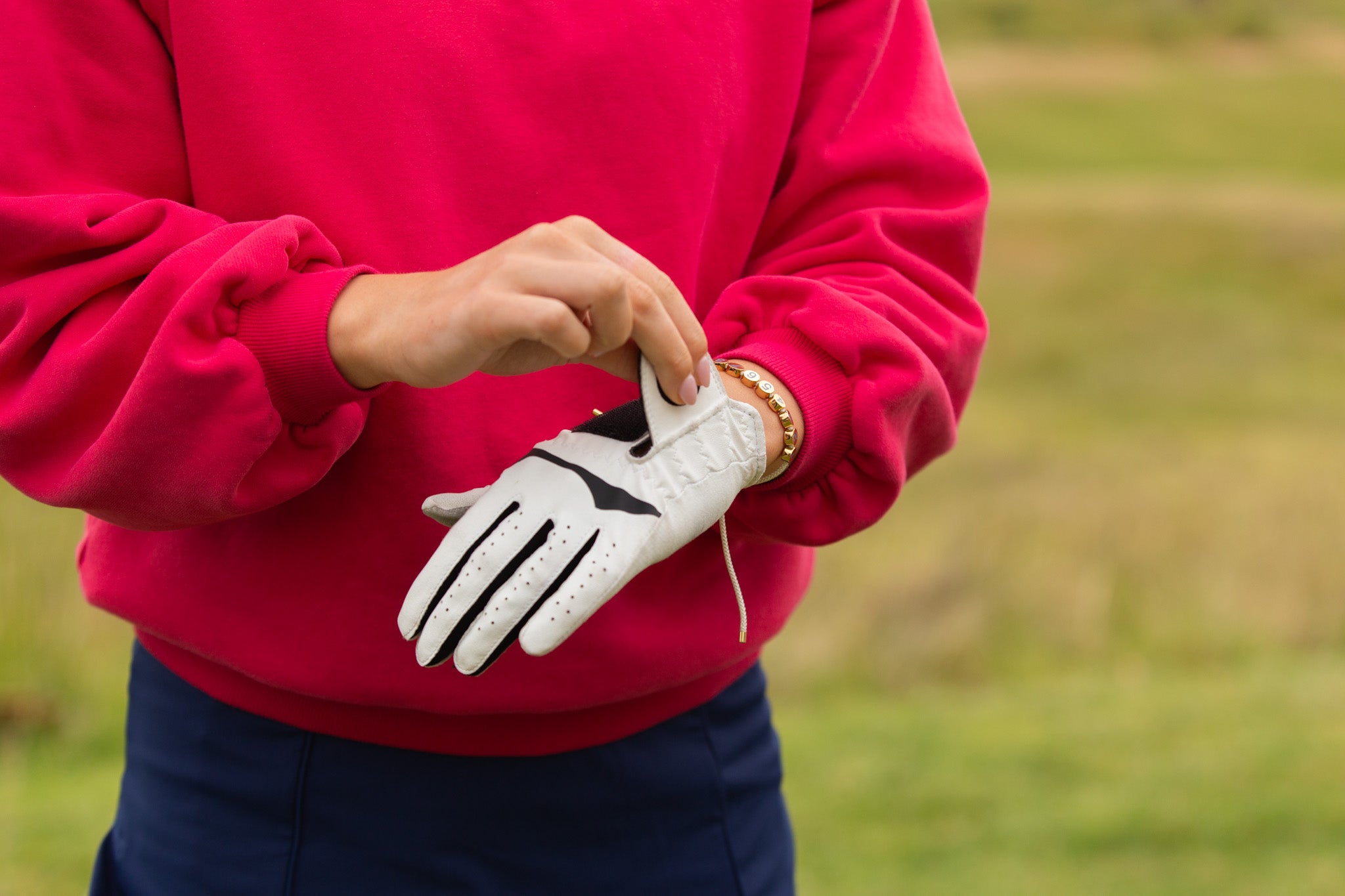 Birdie Club womens golf score counter bracelet with gold plating.